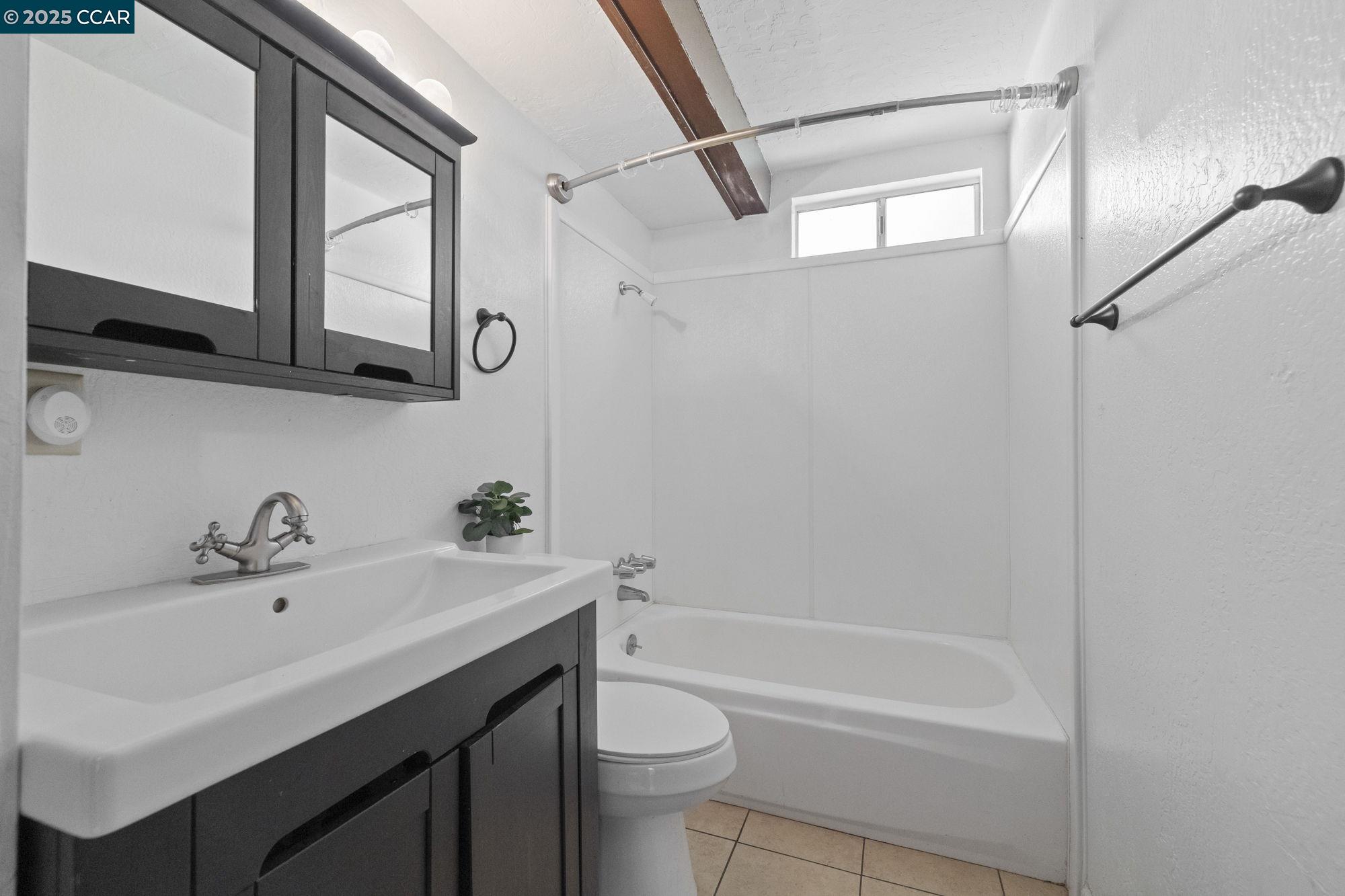 18957 Stag Circle Tuolumne, CA 95379 - Photo 6 of 22 a bathroom with a sink a toilet and a mirror