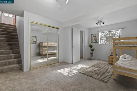 a bedroom with a bed and a view of bathroom