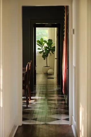 a kitchen with stainless steel appliances granite countertop a sink a stove and white cabinets