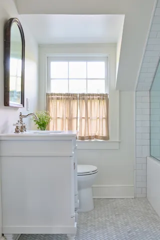 a view of bedroom with furniture and potted plant