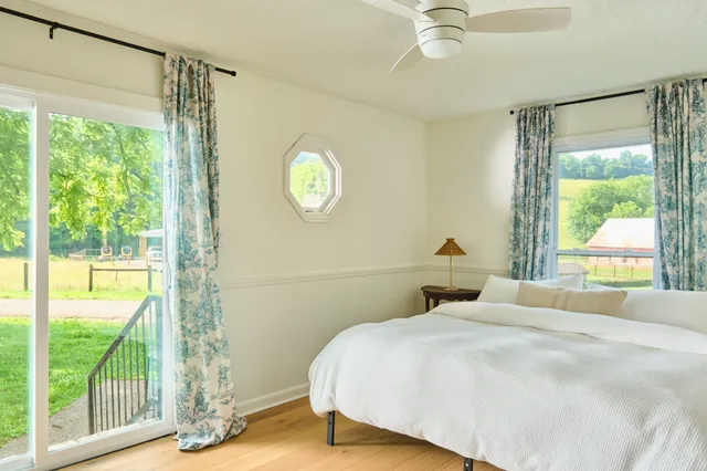 a view of a room with wooden floor
