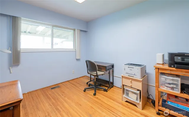 a workspace with furniture and a window