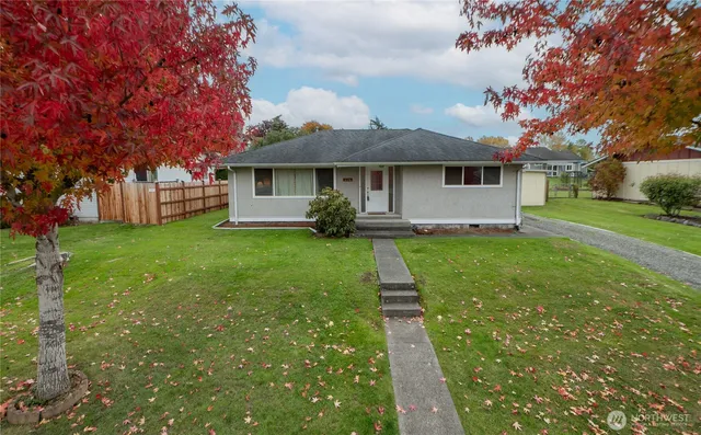 a front view of a house with yard