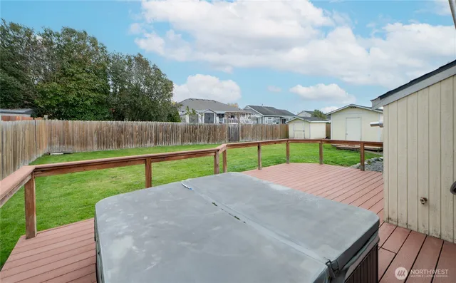 a view of a house with a yard and sitting area