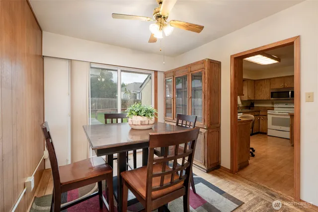 a view of a dining room with furniture window and outside view