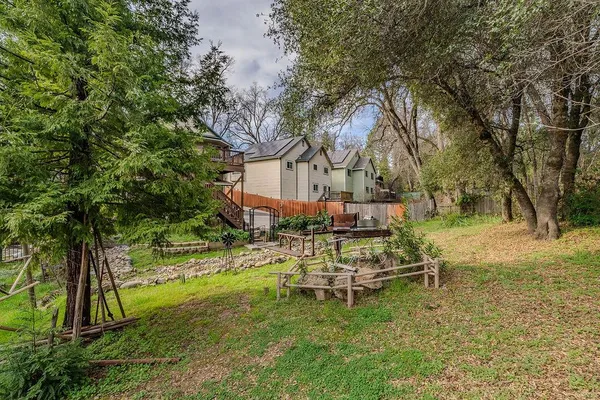 an aerial view of a house with a yard
