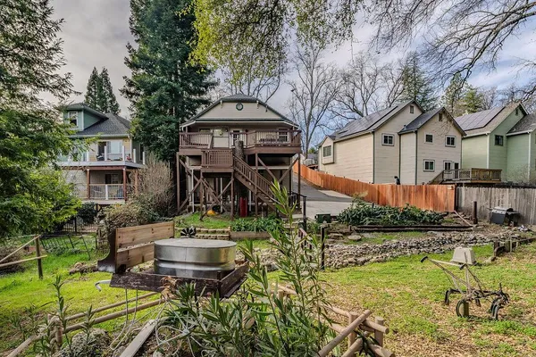 an aerial view of a house with a yard