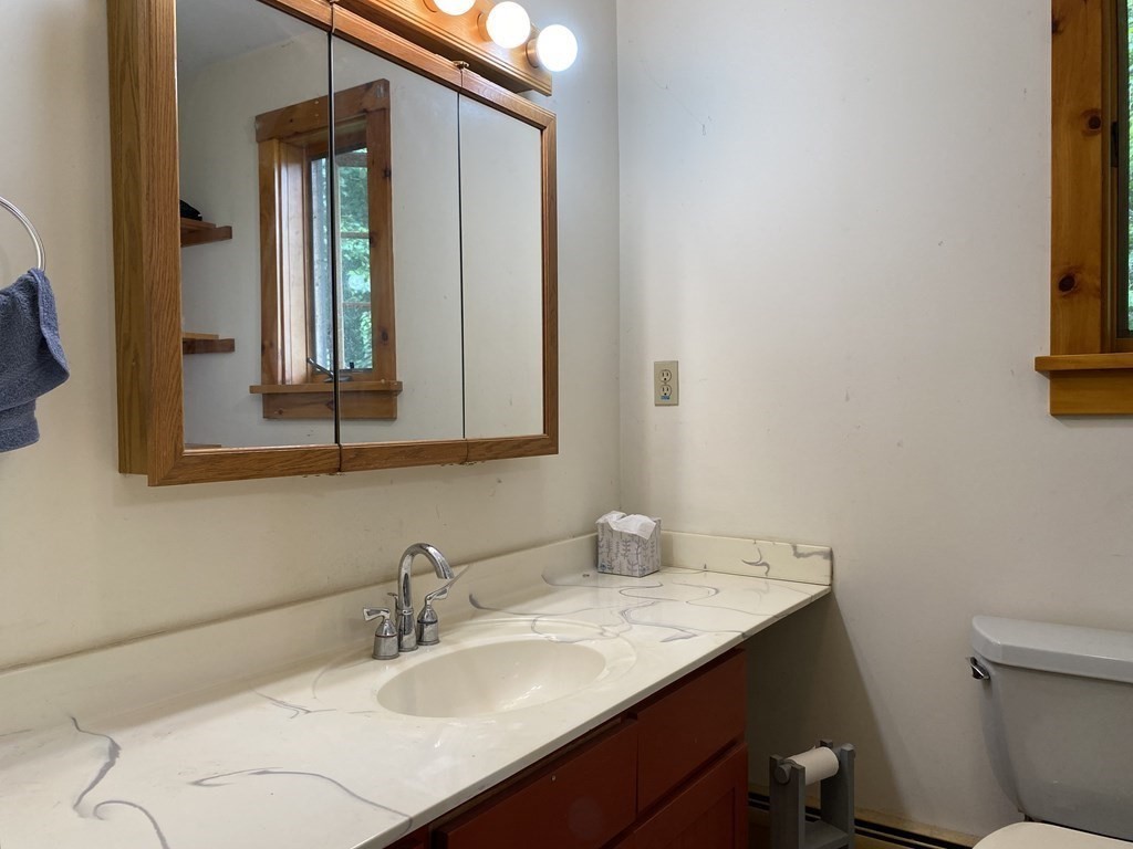 72 North Hillside Road Deerfield, MA 01373 - Photo 17 of 29 a bathroom with a sink and a mirror