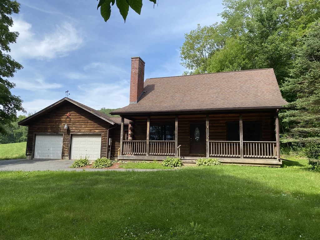 72 North Hillside Road Deerfield, MA 01373 - Photo 2 of 29 a front view of a house with a garden