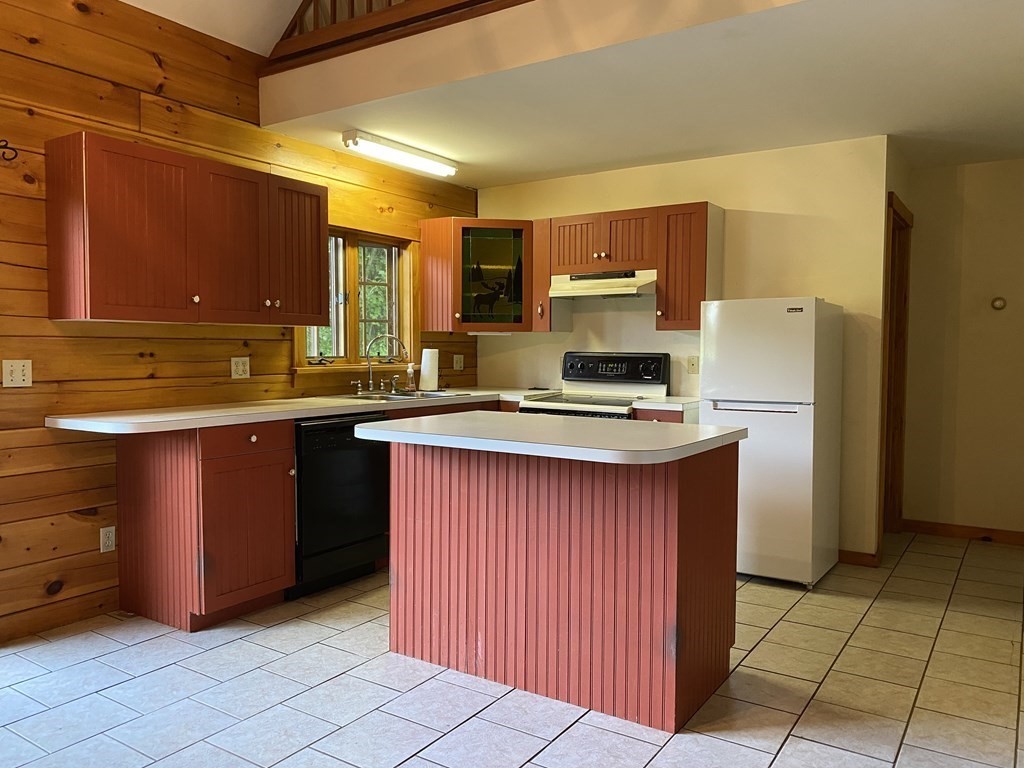 72 North Hillside Road Deerfield, MA 01373 - Photo 4 of 29 a kitchen with stainless steel appliances granite countertop a refrigerator a sink and a stove