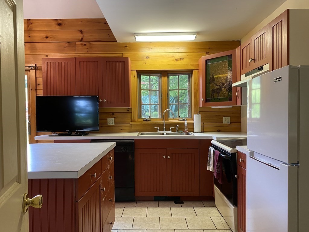 72 North Hillside Road Deerfield, MA 01373 - Photo 9 of 29 a kitchen with stainless steel appliances granite countertop a refrigerator and a sink
