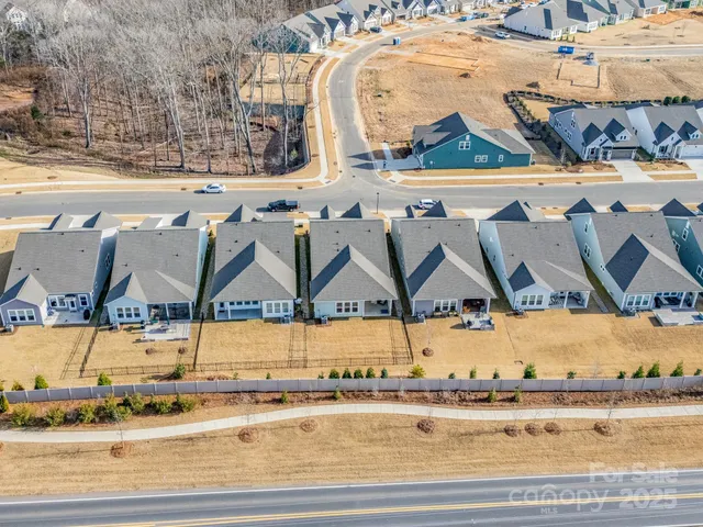 a view of swimming pool next to a yard