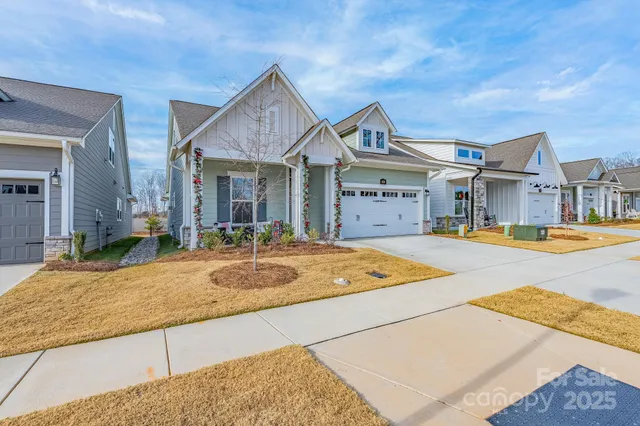 a house with swimming pool in front of it