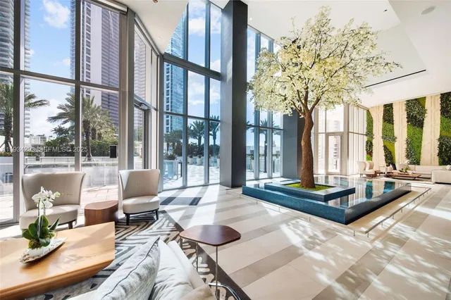 a living room with furniture and a large window