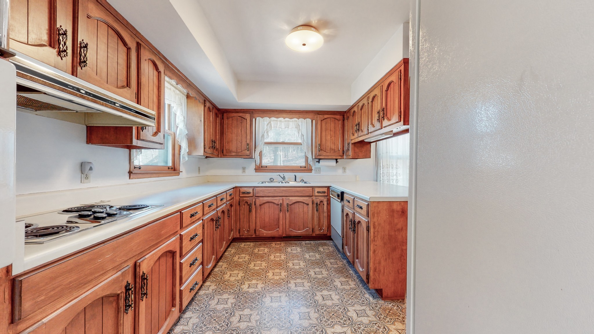 2124 Hillsboro Road Franklin, TN 37069 - Photo 11 of 44 a kitchen with stainless steel appliances granite countertop a stove and a refrigerator