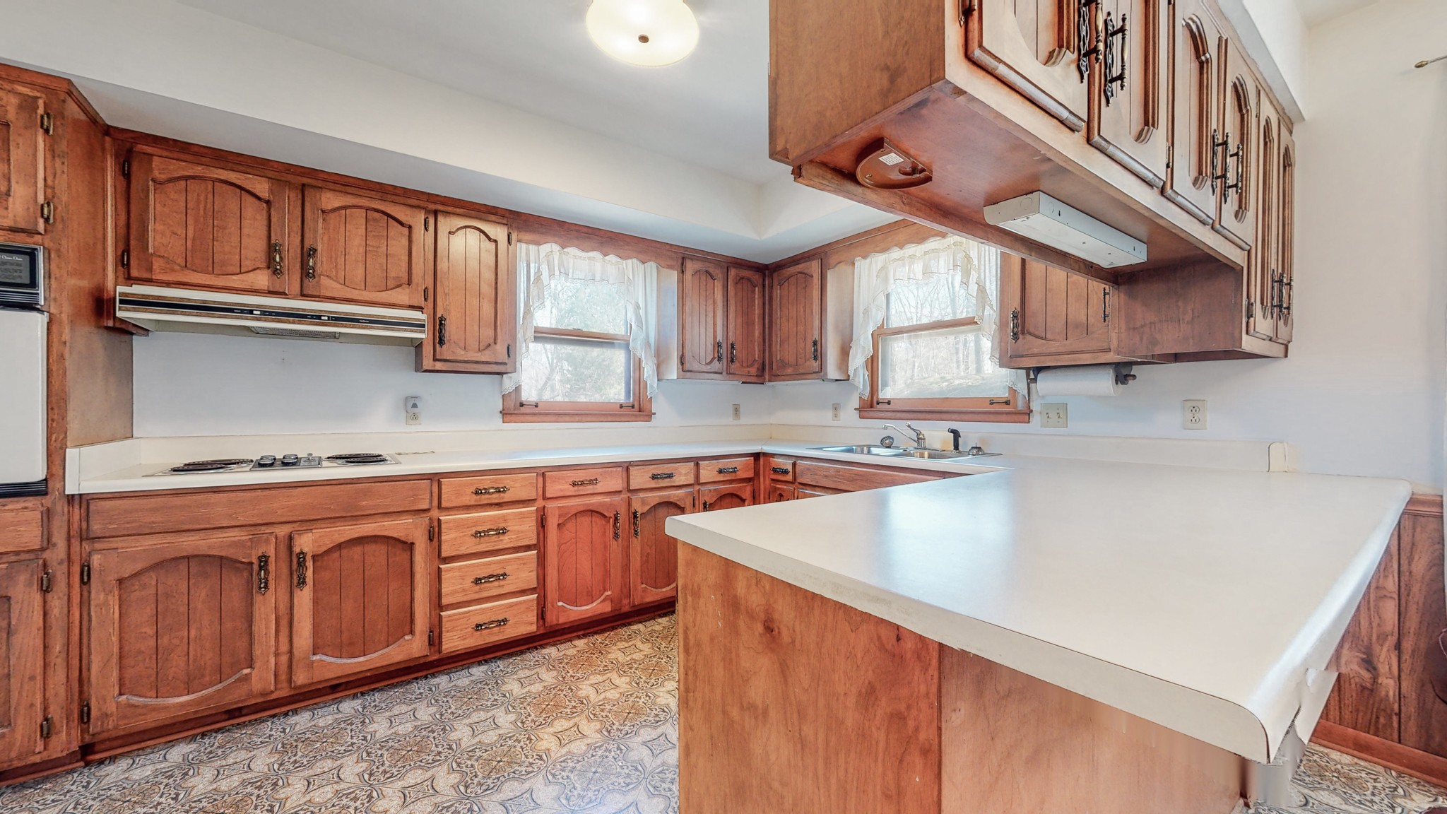 2124 Hillsboro Road Franklin, TN 37069 - Photo 13 of 44 a kitchen with stainless steel appliances granite countertop a sink a stove cabinets counter space and a window