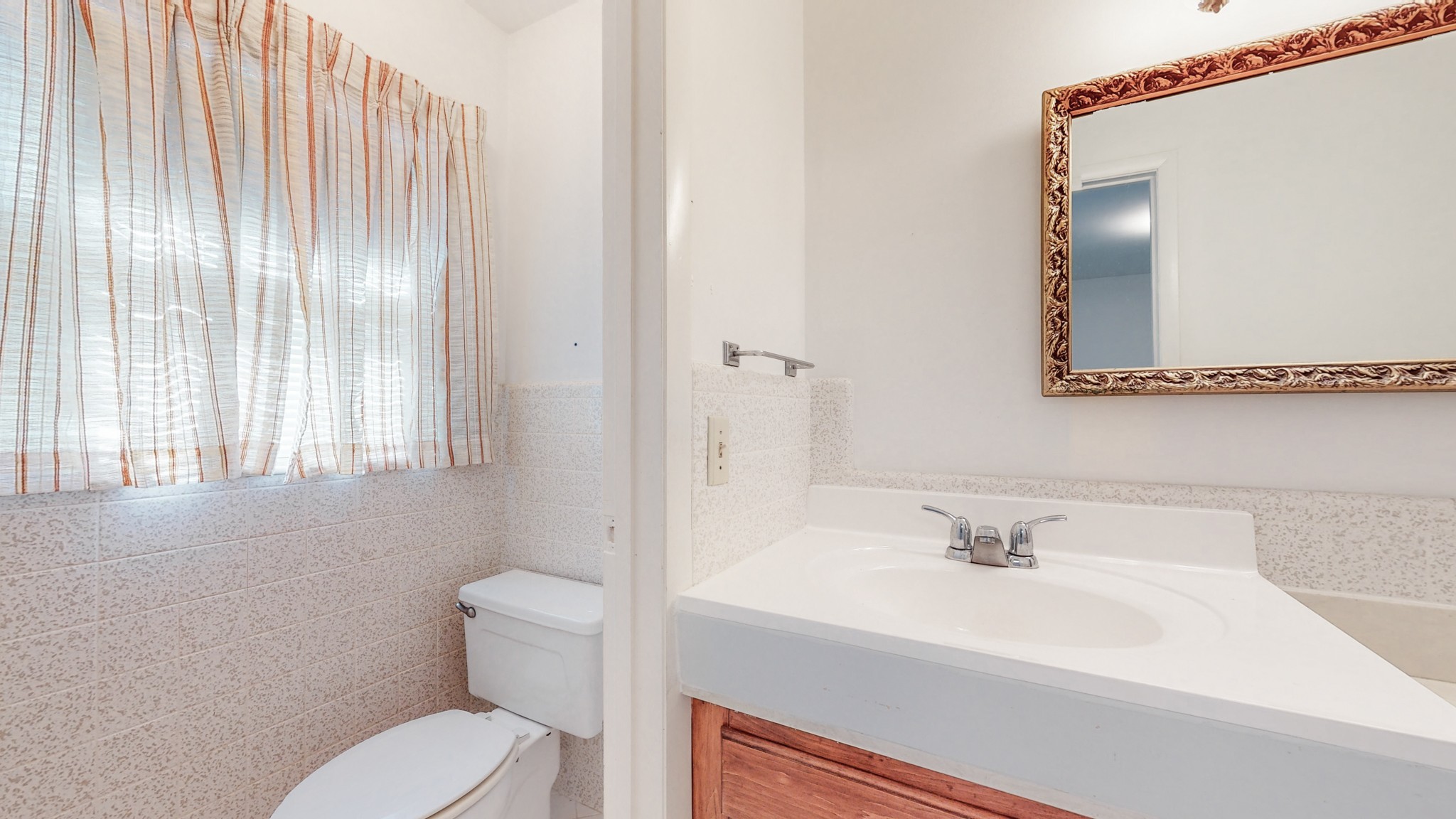 2124 Hillsboro Road Franklin, TN 37069 - Photo 18 of 44 a bathroom with a sink a toilet and mirror