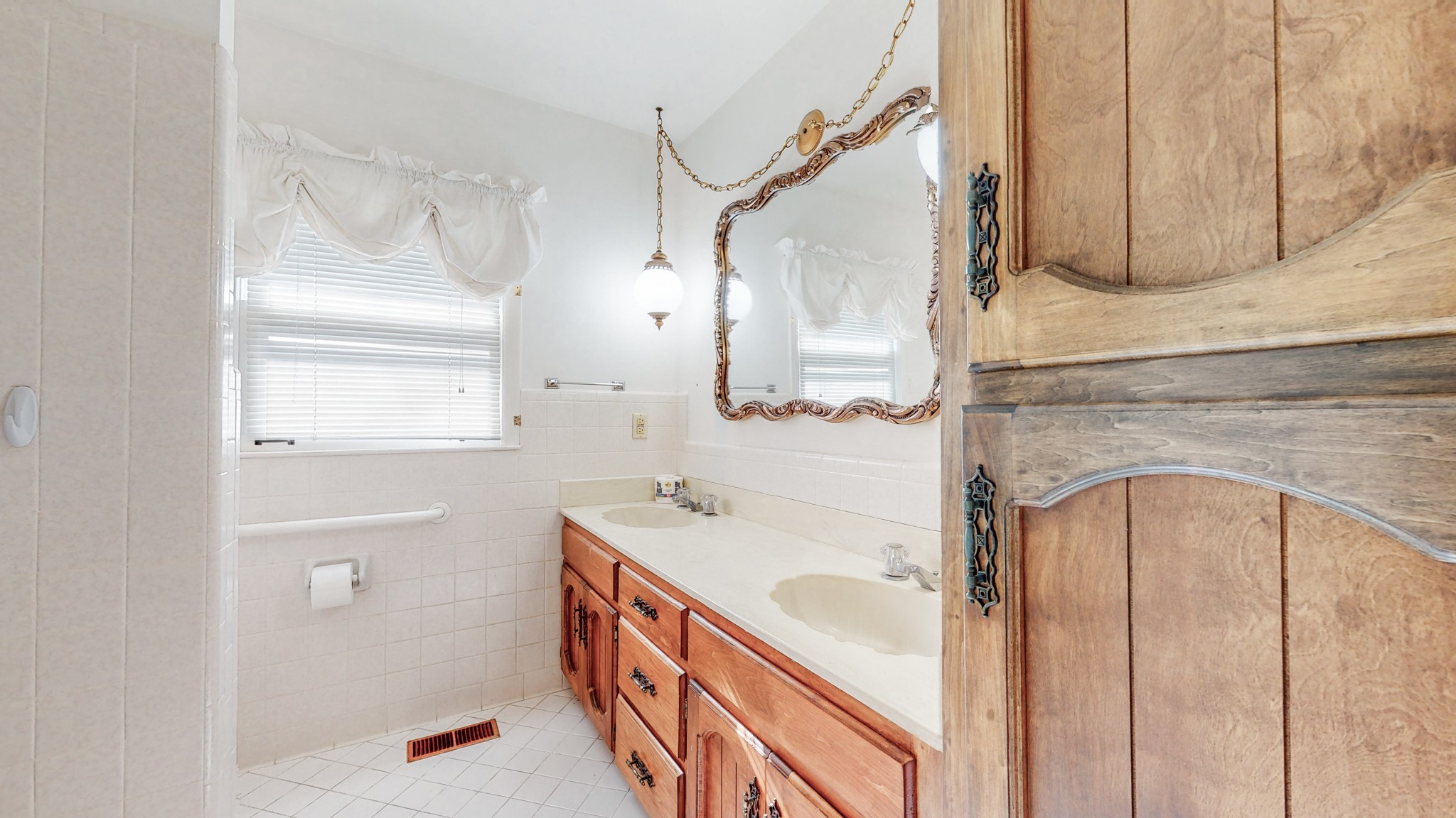 2124 Hillsboro Road Franklin, TN 37069 - Photo 21 of 44 a bathroom with a sink a mirror and shower