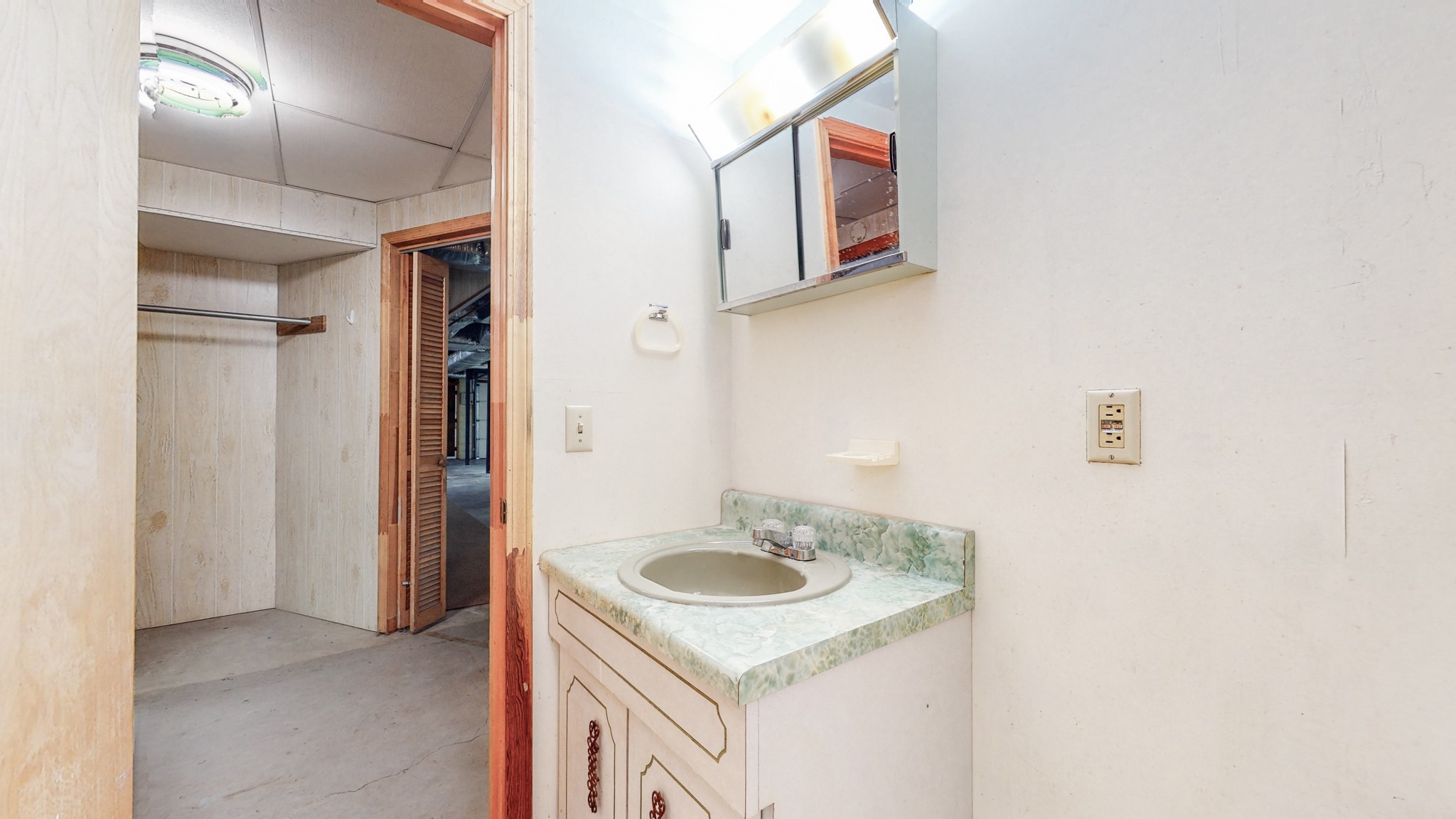 2124 Hillsboro Road Franklin, TN 37069 - Photo 28 of 44 a bathroom with a sink and a mirror