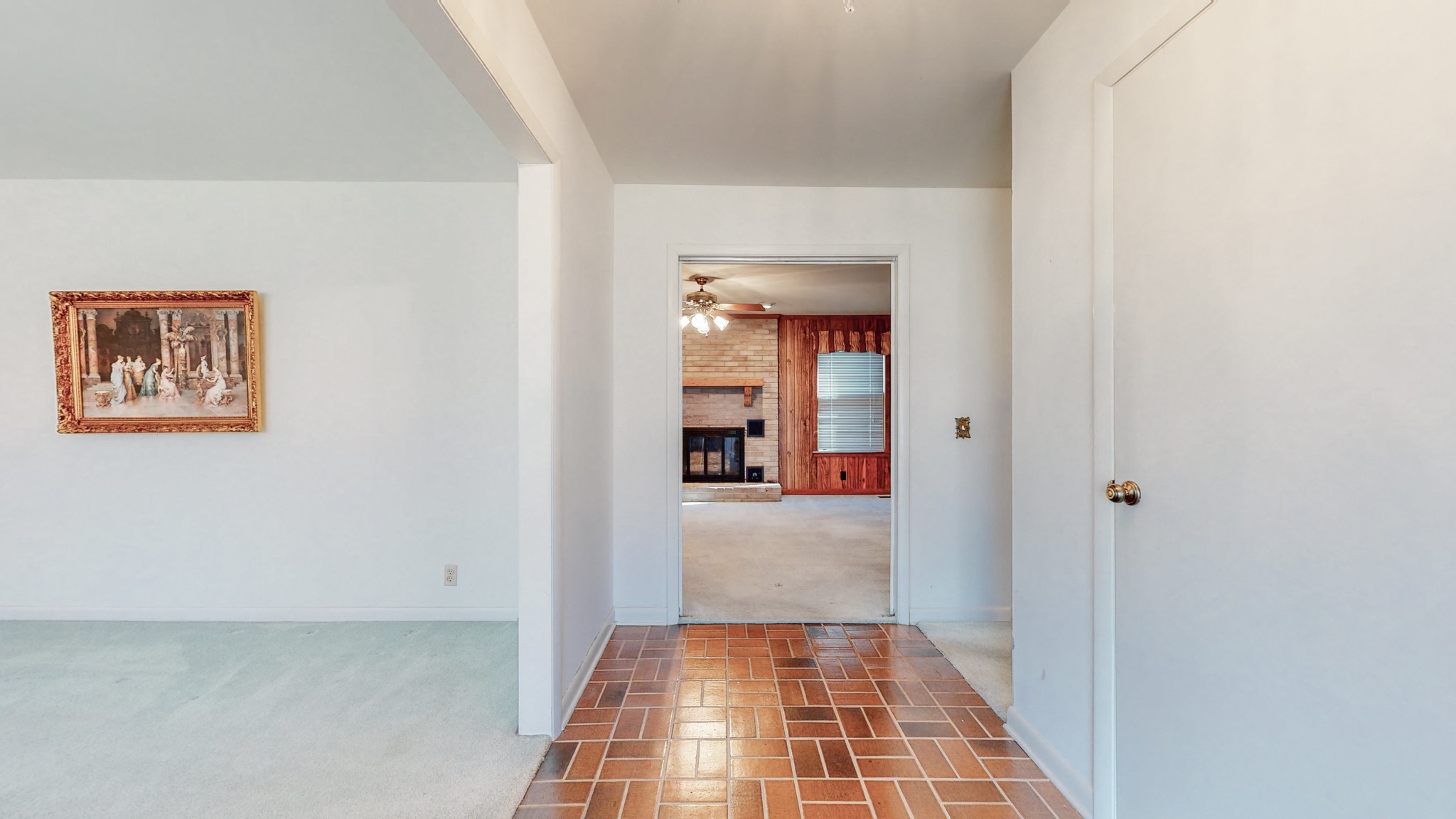 2124 Hillsboro Road Franklin, TN 37069 - Photo 6 of 44 a view of a hallway with wooden floor and a living room