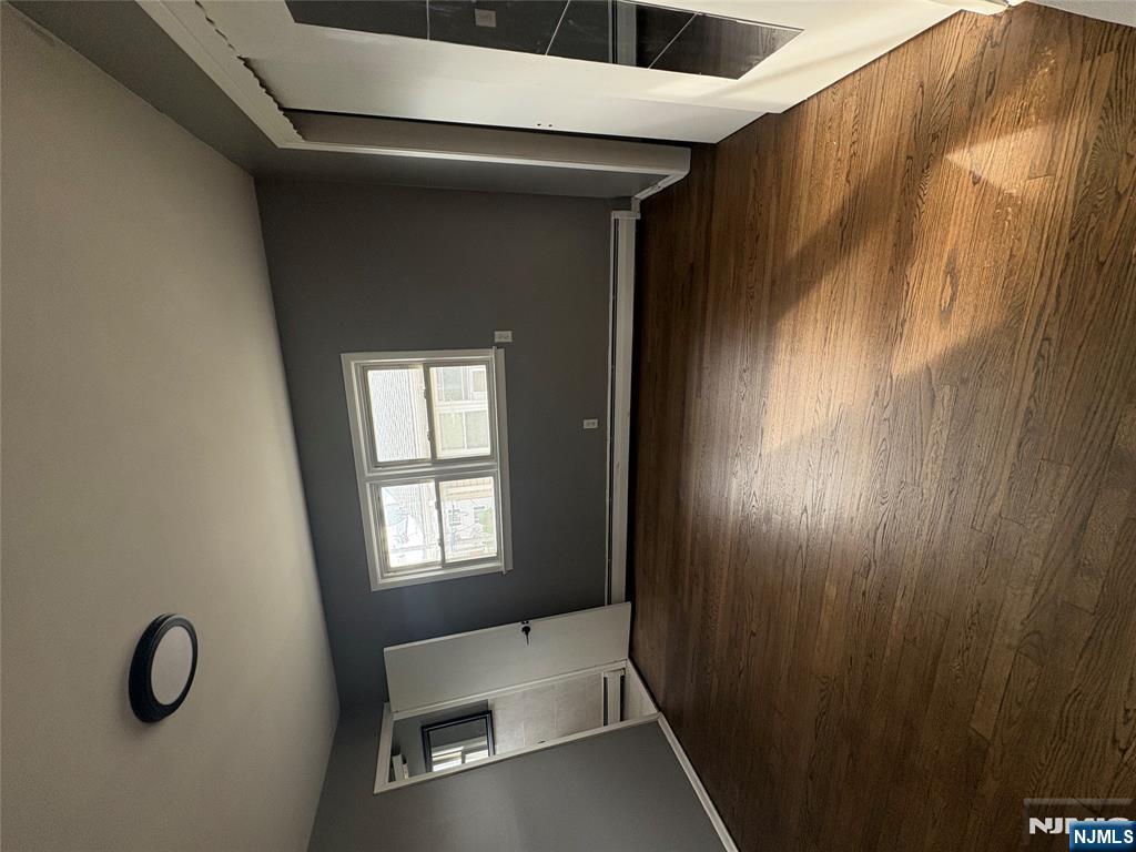 10 Strong Street, Unit 2 Wallington, NJ 07057 - Photo 8 of 12 a view of room with window and wooden floor