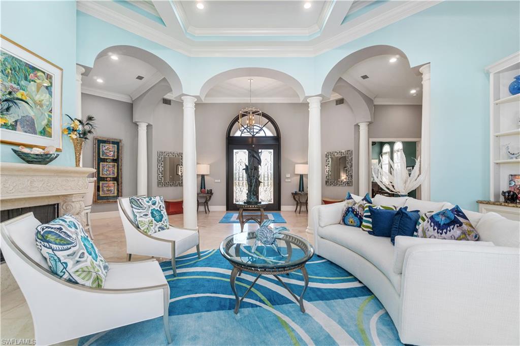 208 Audubon Boulevard Naples, FL 34110 - Photo 16 of 45 a living room with furniture and a large window