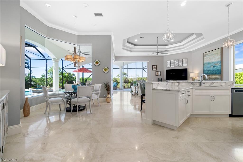208 Audubon Boulevard Naples, FL 34110 - Photo 23 of 45 a view of kitchen with sink and microwave