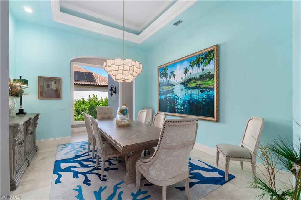 208 Audubon Boulevard Naples, FL 34110 - Photo 26 of 45 a view of a dining room with furniture window and wooden floor