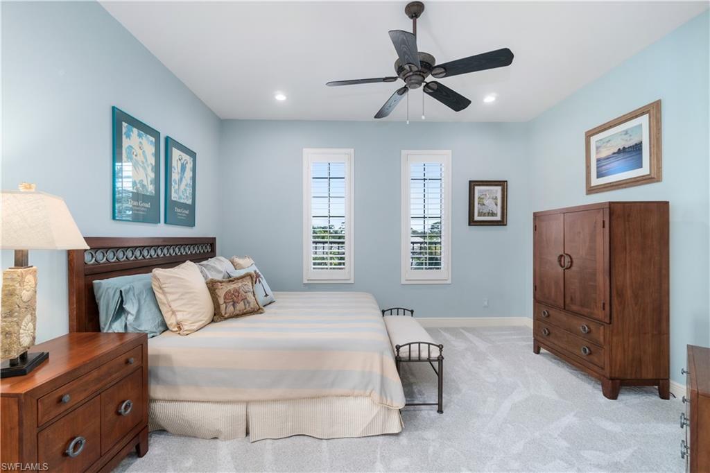 208 Audubon Boulevard Naples, FL 34110 - Photo 32 of 45 a bedroom with a bed and a window