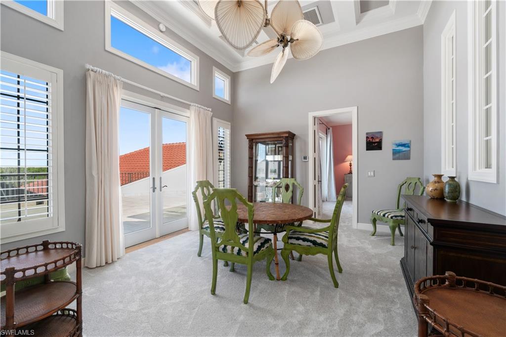 208 Audubon Boulevard Naples, FL 34110 - Photo 34 of 45 a view of a dining room with furniture and a window