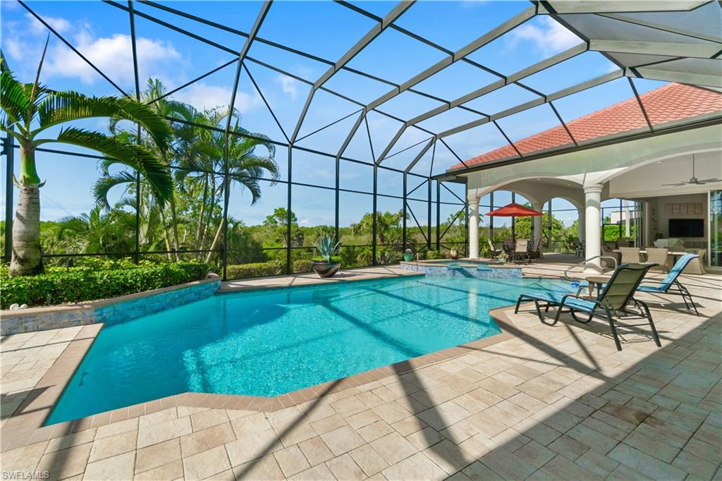 208 Audubon Boulevard Naples, FL 34110 - Photo 40 of 45 a view of a backyard with plants and a patio