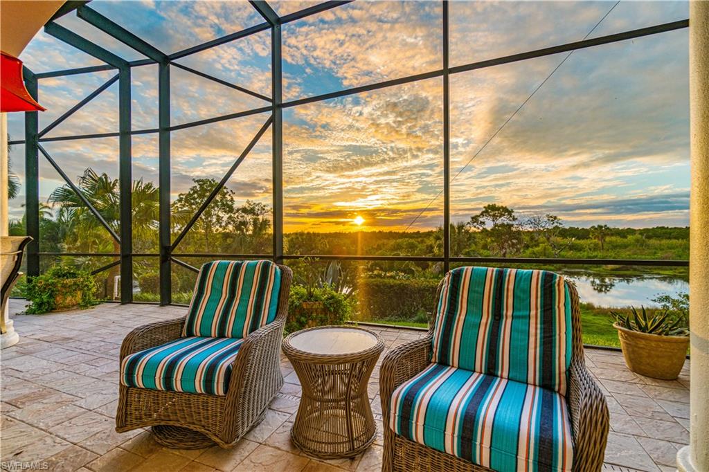 208 Audubon Boulevard Naples, FL 34110 - Photo 42 of 45 a view of a balcony with furniture and wooden floor
