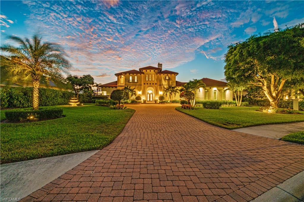 208 Audubon Boulevard Naples, FL 34110 - Photo 8 of 45 a view of a yard with plants
