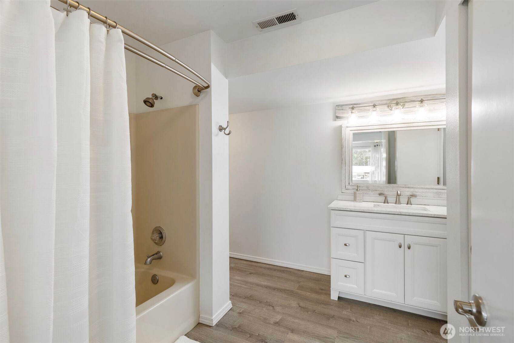 14110 Glenwood Road Southwest Port Orchard, WA 98367 - Photo 25 of 40 a bathroom with a sink a toilet and shower