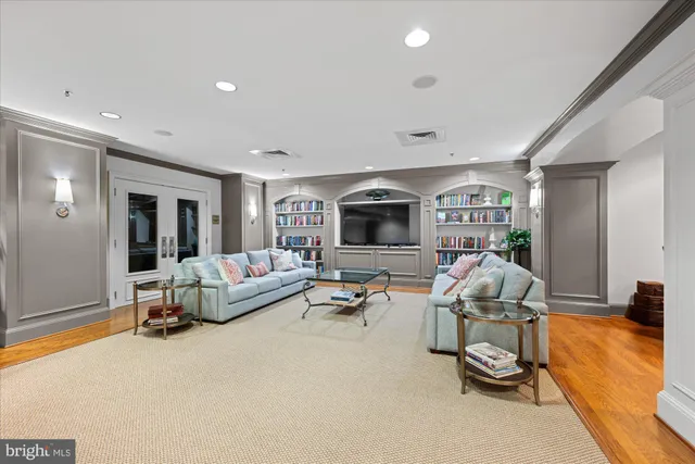 a kitchen with stainless steel appliances granite countertop wooden cabinets a stove a sink and a oven