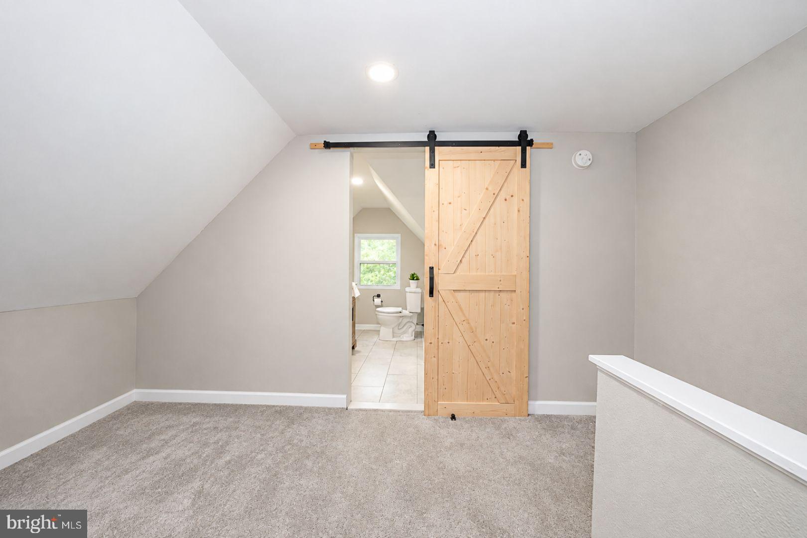 131 Biddle Road Paoli, PA 19301 - Photo 31 of 42 Barn Door to Full Bathroom