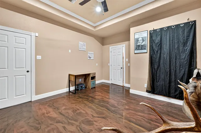 a view of a livingroom with furniture and a ceiling fan