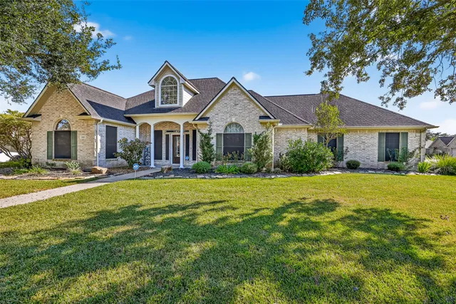a front view of a house with a yard table and chairs