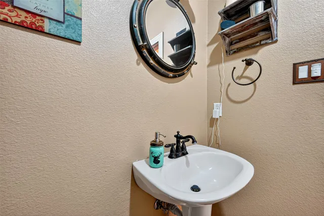 a living room with furniture a flat screen tv and a window
