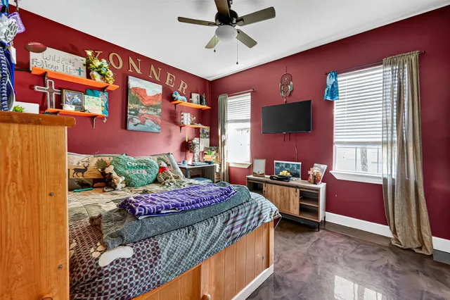 a bed room with a bed and a chair