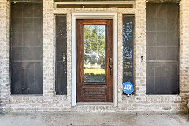 a front view of a house with a glass door