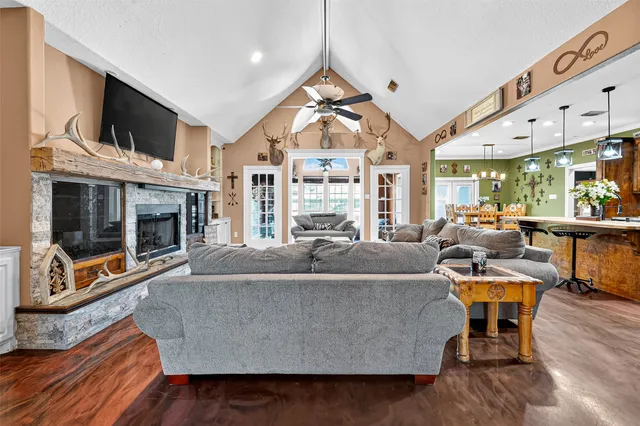 a living room with furniture and a fireplace
