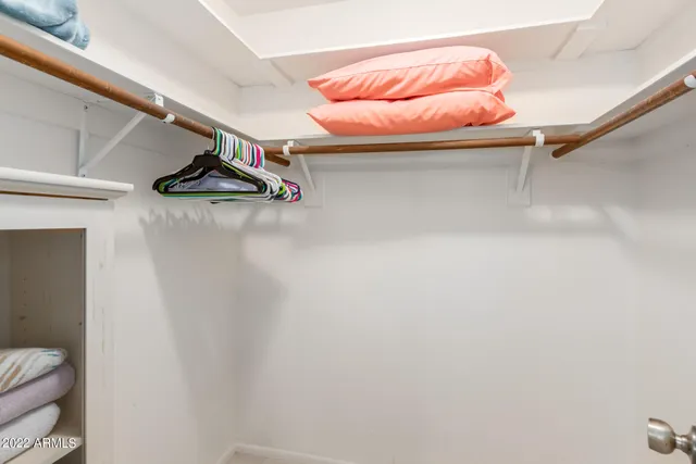 a picture of a room with racks on the wall