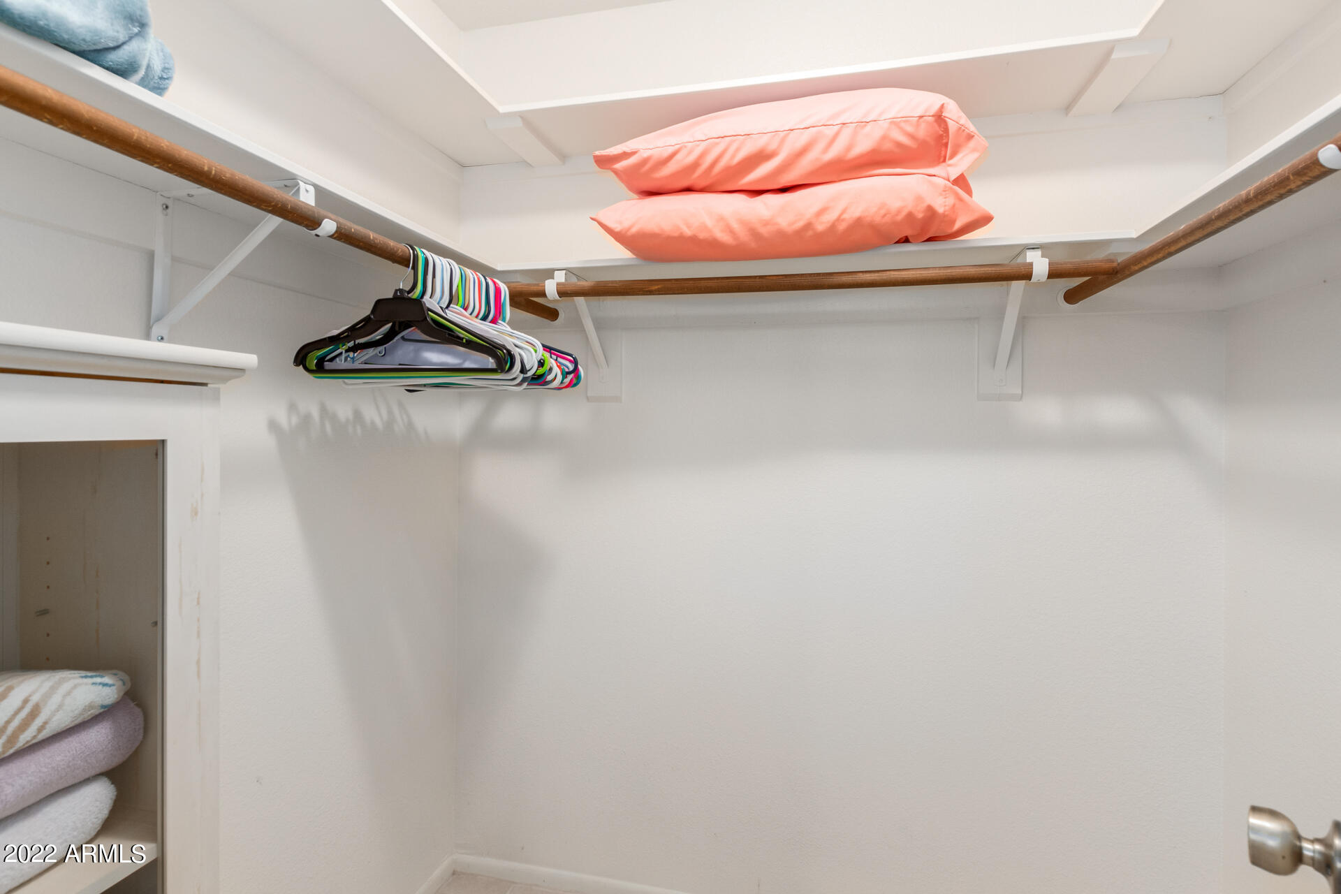 7005 East Broadway Road, Unit 28 Mesa, AZ 85208 - Photo 18 of 27 a picture of a room with racks on the wall