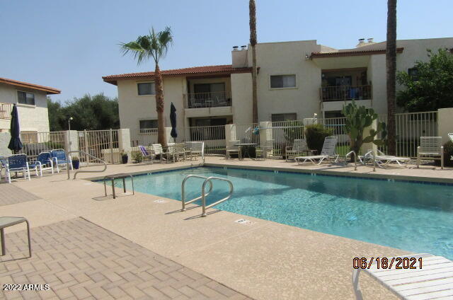 7005 East Broadway Road, Unit 28 Mesa, AZ 85208 - Photo 24 of 27 a view of a house with garden and sitting area