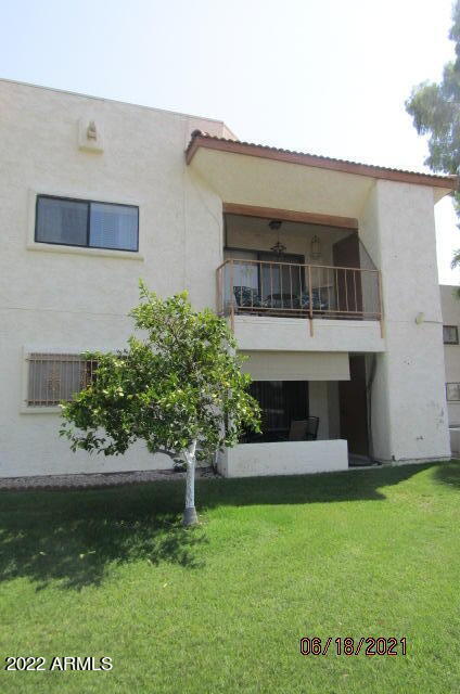 7005 East Broadway Road, Unit 28 Mesa, AZ 85208 - Photo 25 of 27 a front view of a house with a garden