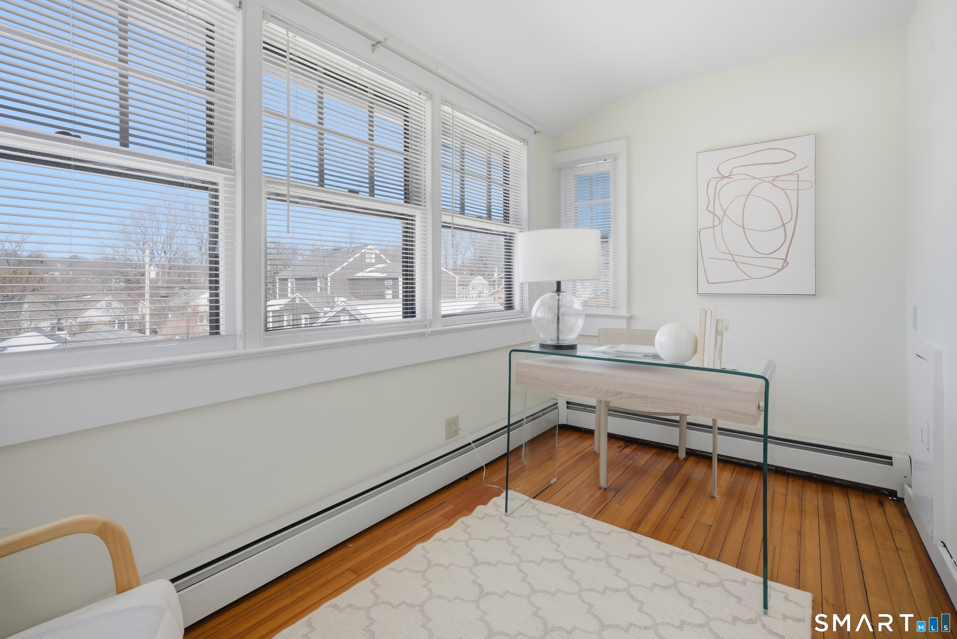 224 Homeland Street Fairfield, CT 06825 - Photo 16 of 37 a room with window and a table