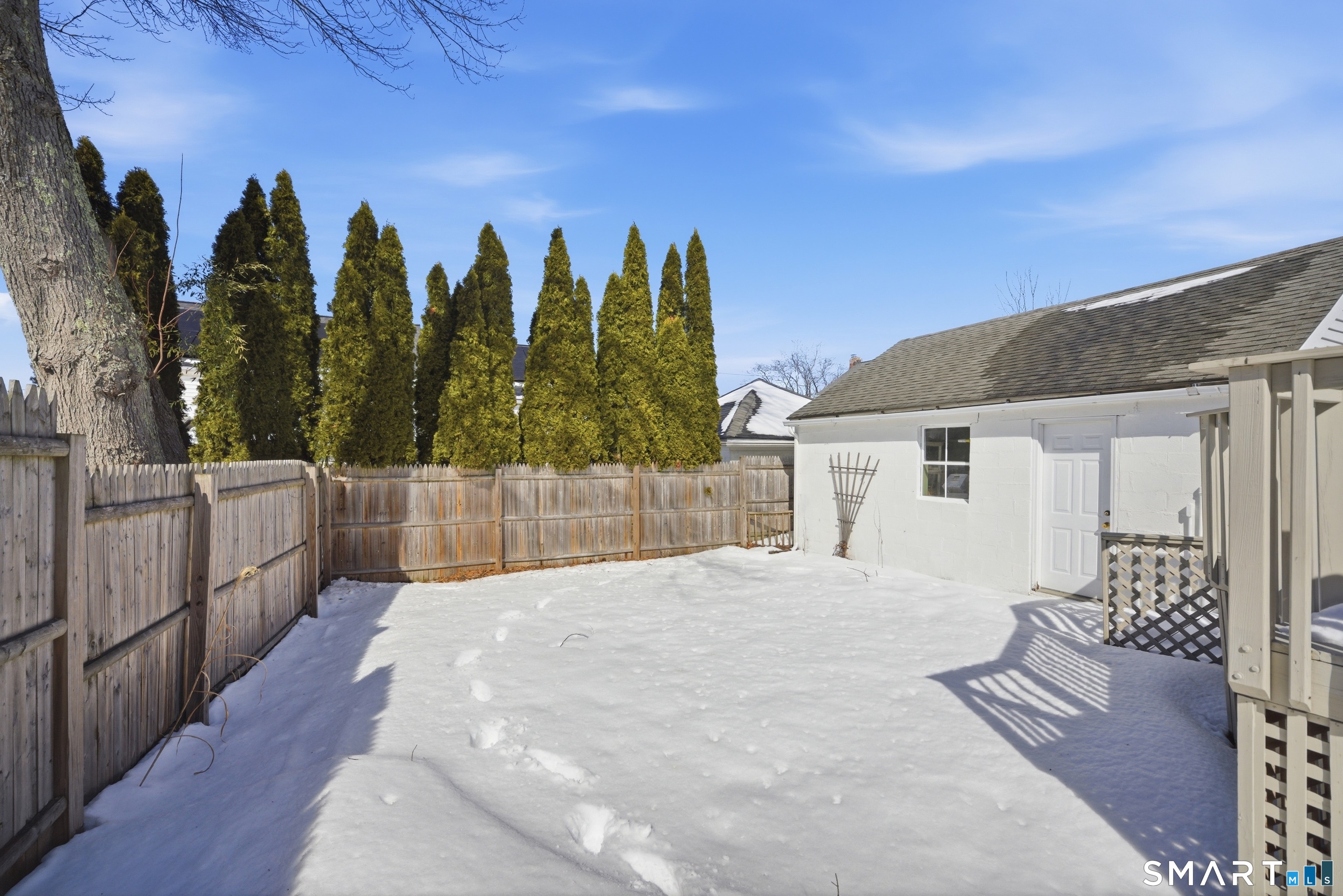 224 Homeland Street Fairfield, CT 06825 - Photo 28 of 37 a view of a house with wooden floor and a yard