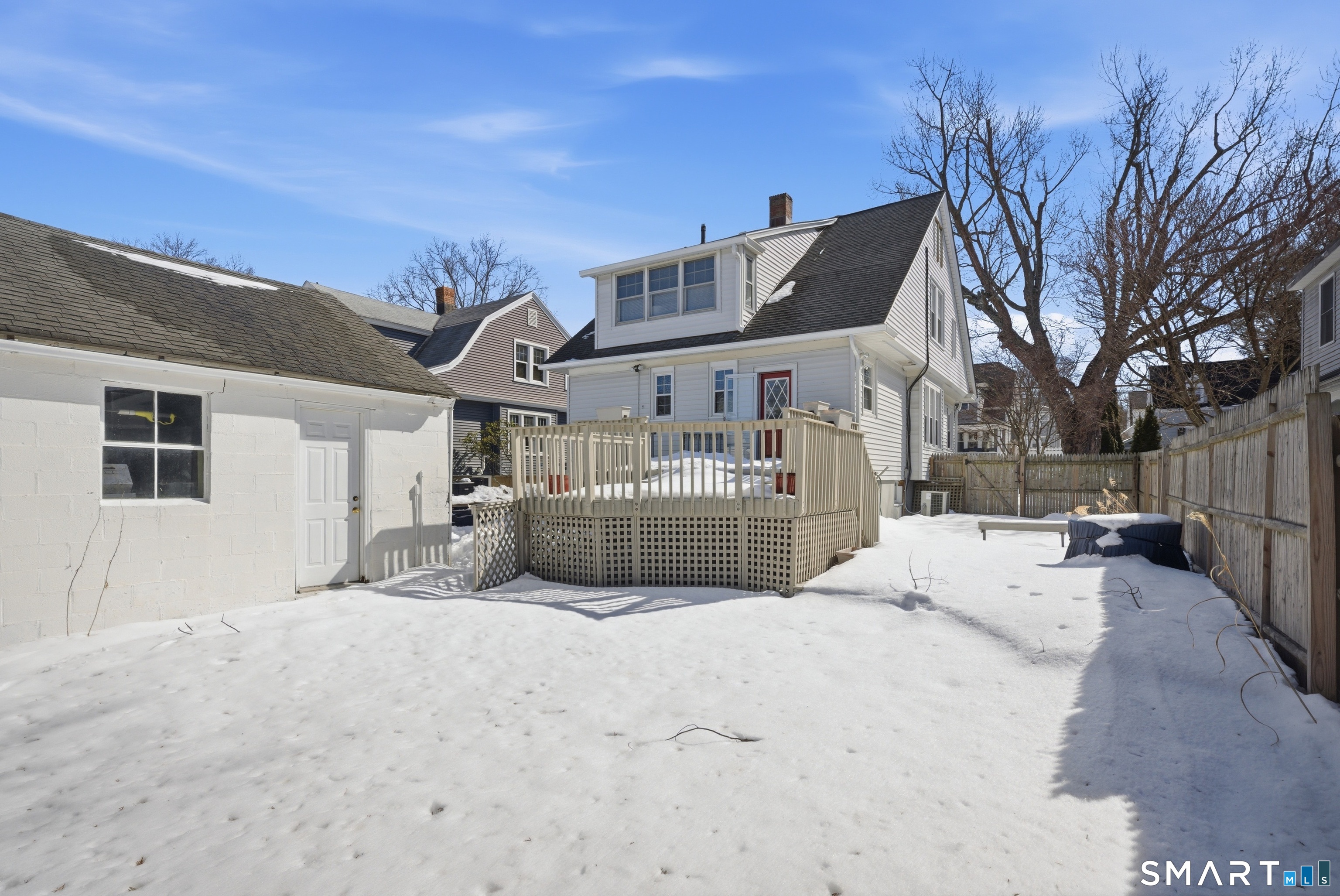 224 Homeland Street Fairfield, CT 06825 - Photo 29 of 37 a view of a house with a snow in the background