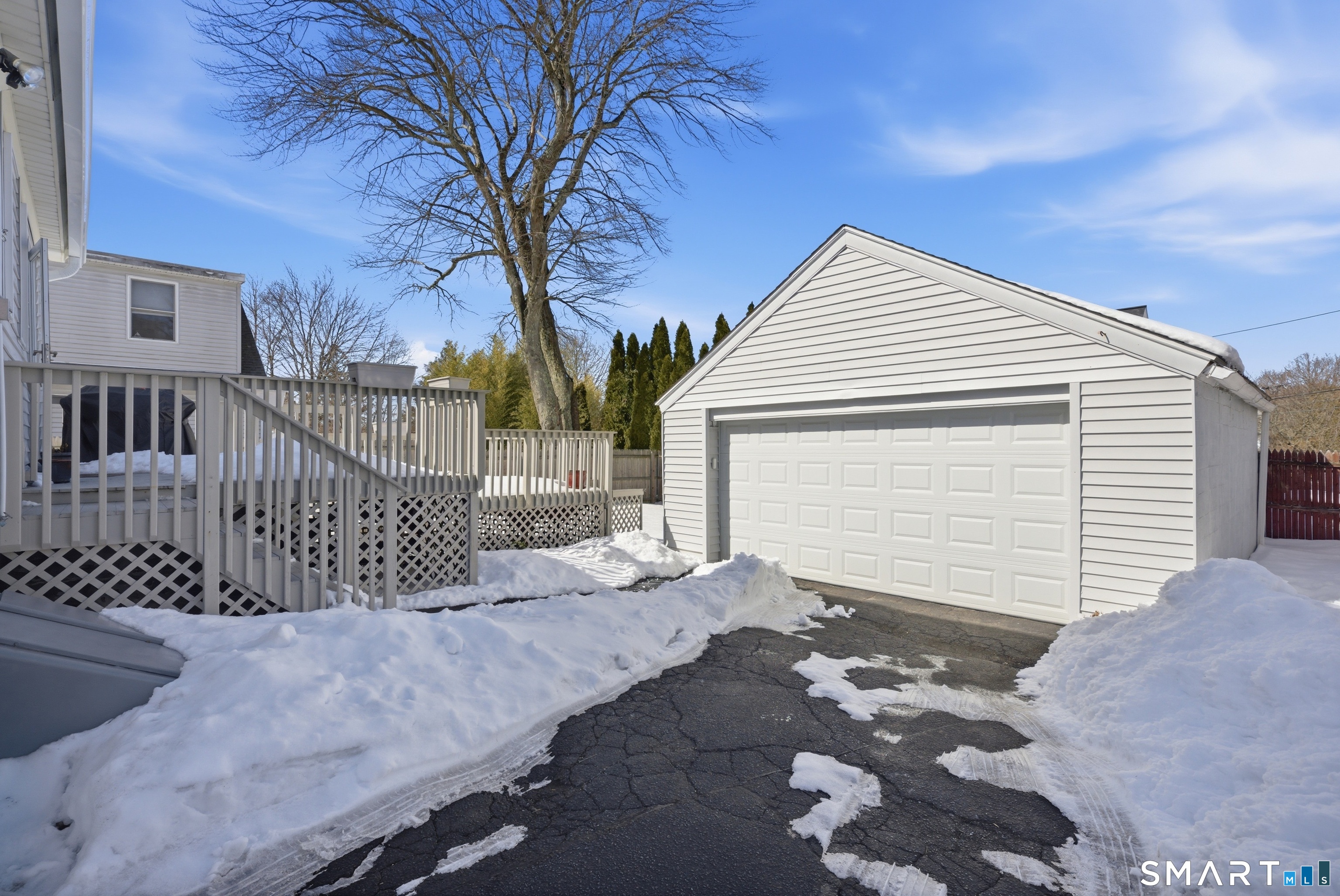224 Homeland Street Fairfield, CT 06825 - Photo 30 of 37 a view of a house with a snow